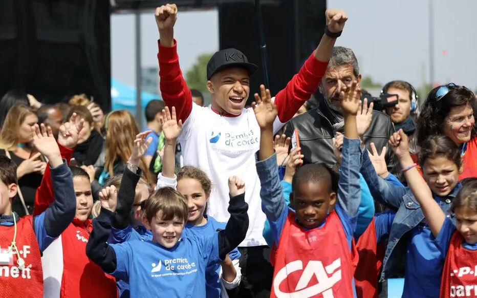 Kylian Mbappe with associations for kids